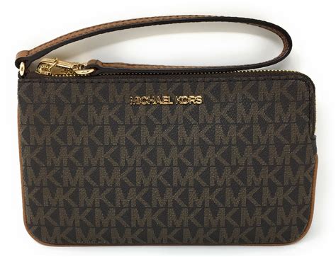 michael kors mk logo brown large wristlet|Michael Kors clutch.